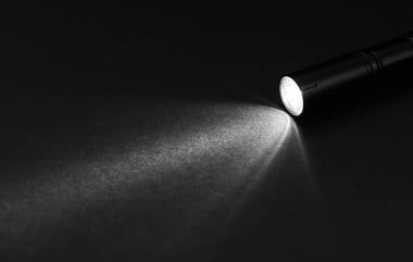 flashlight illuminating dark room